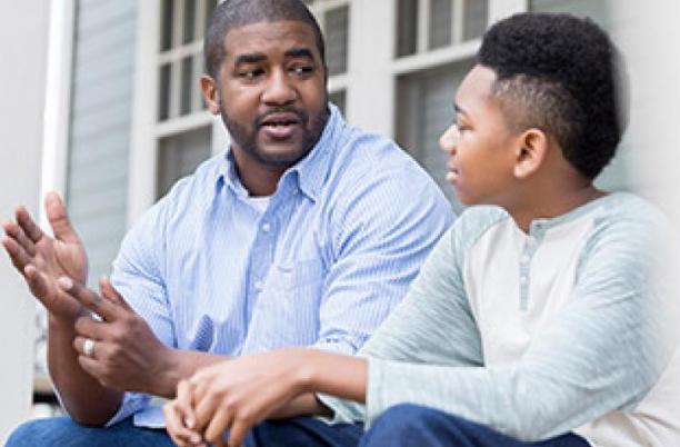 Father with boy having a conversation