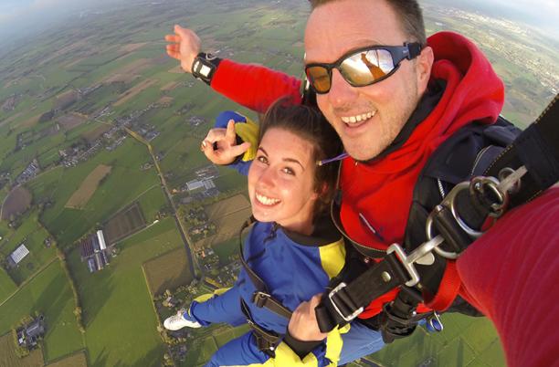 A stock photo of two people skydiving