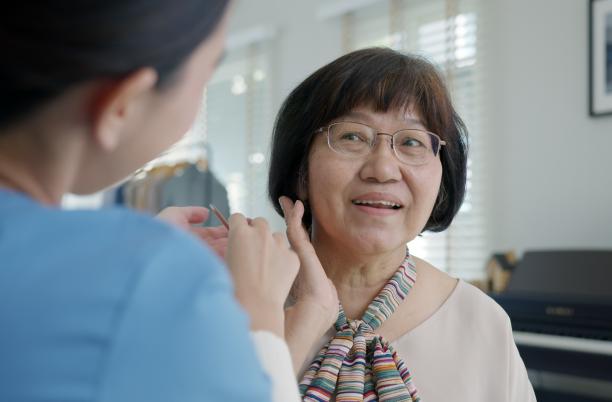 Woman talking to a care worker