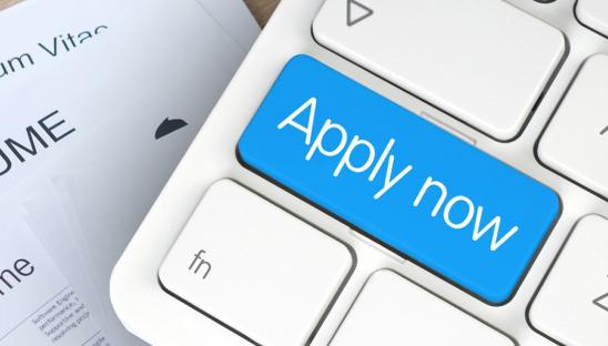 Picture of a keyboard with Apply now written on it