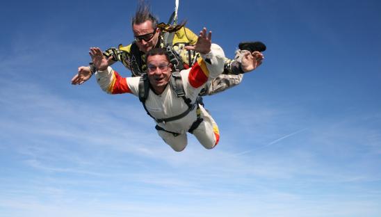 A stock photo of people doing a tandem skydive